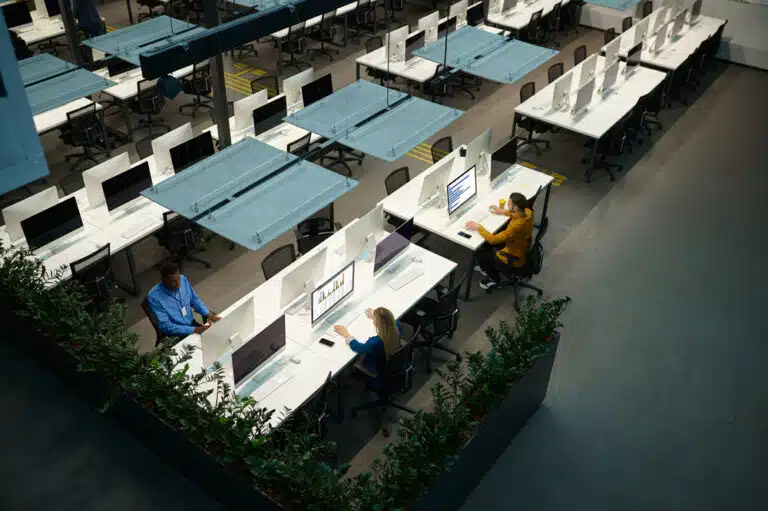 people working in a large office space