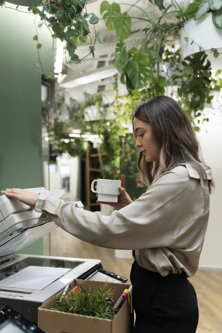 a woman using eco-friendly paper in a photocopier