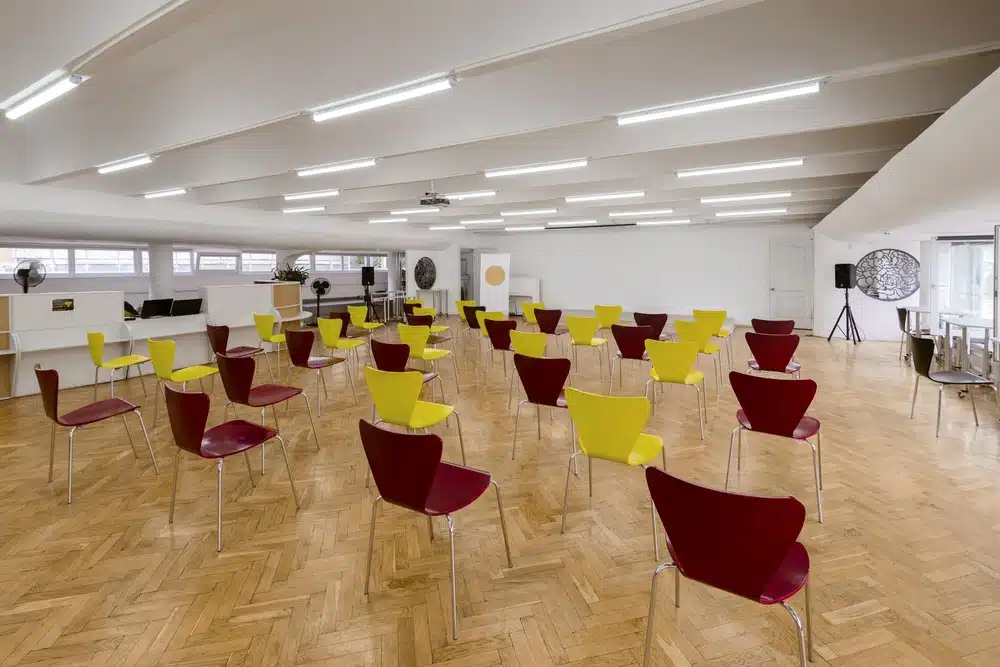 a comprehensive school hall filled with chairs after a fit-out