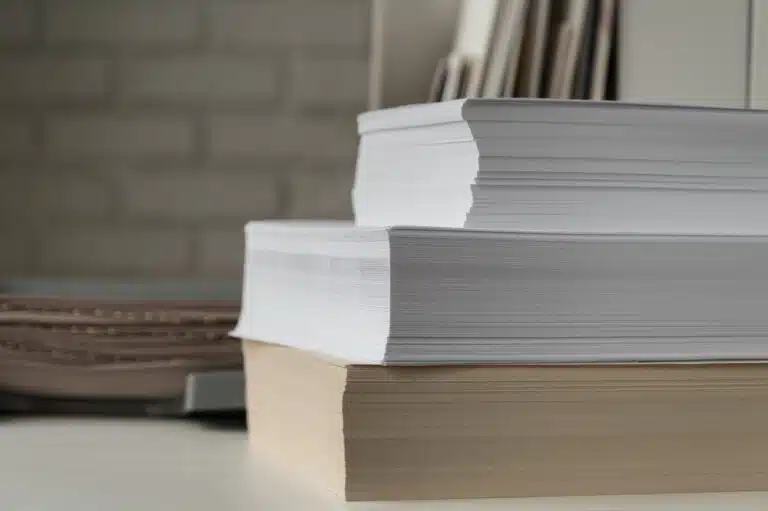 a stack of printed papers